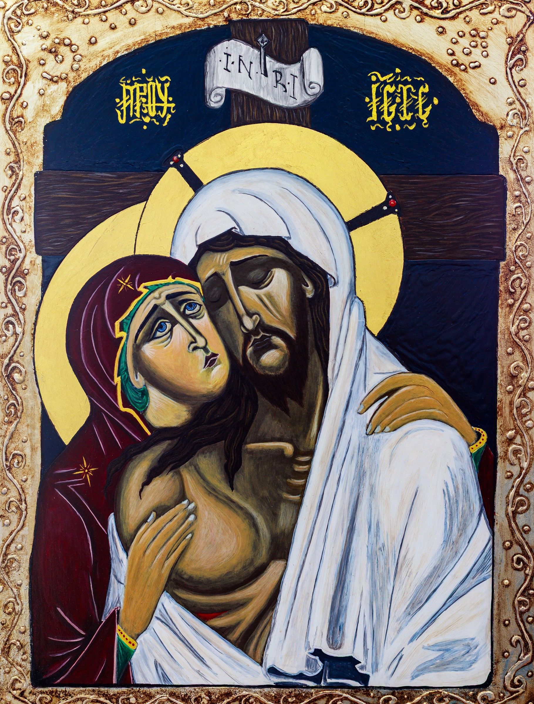 Icône de la Pietà : la Mère de Dieu embrasse le Christ mort, fond bleu nuit, bordure dorée ornementale, inscriptions grecques