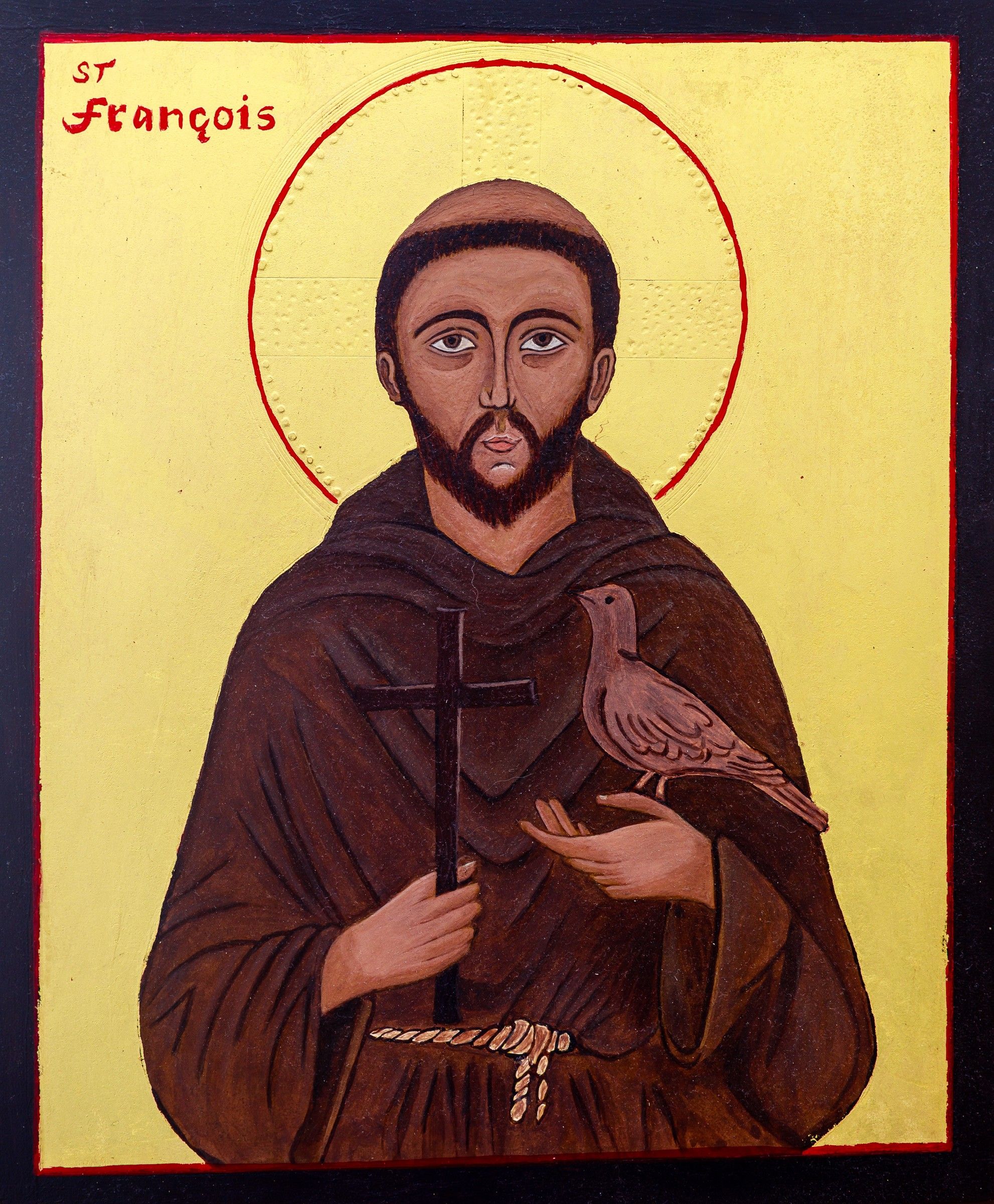 Icône de saint François d'Assise en bure brune, tenant une croix et une colombe, inscription « St François », fond d'or, bordure noire